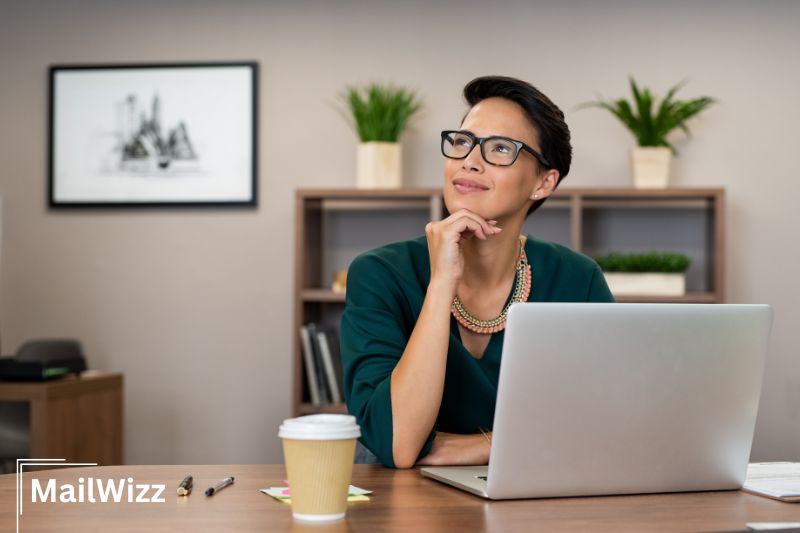 Women stands in front a laptop